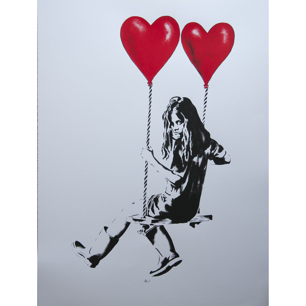 Girl on a swing with balloons