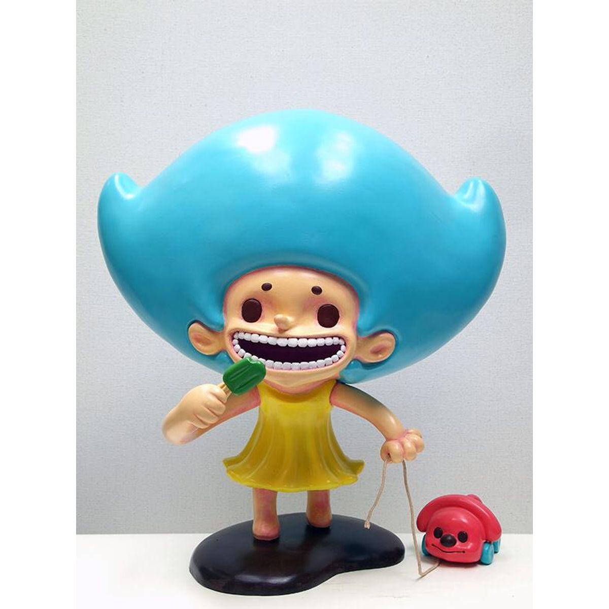 child holding puppy piggy bank