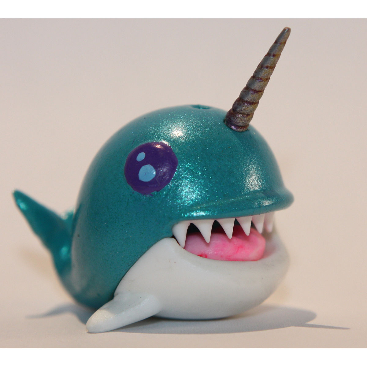 Teal Narwhale Purple Eyes