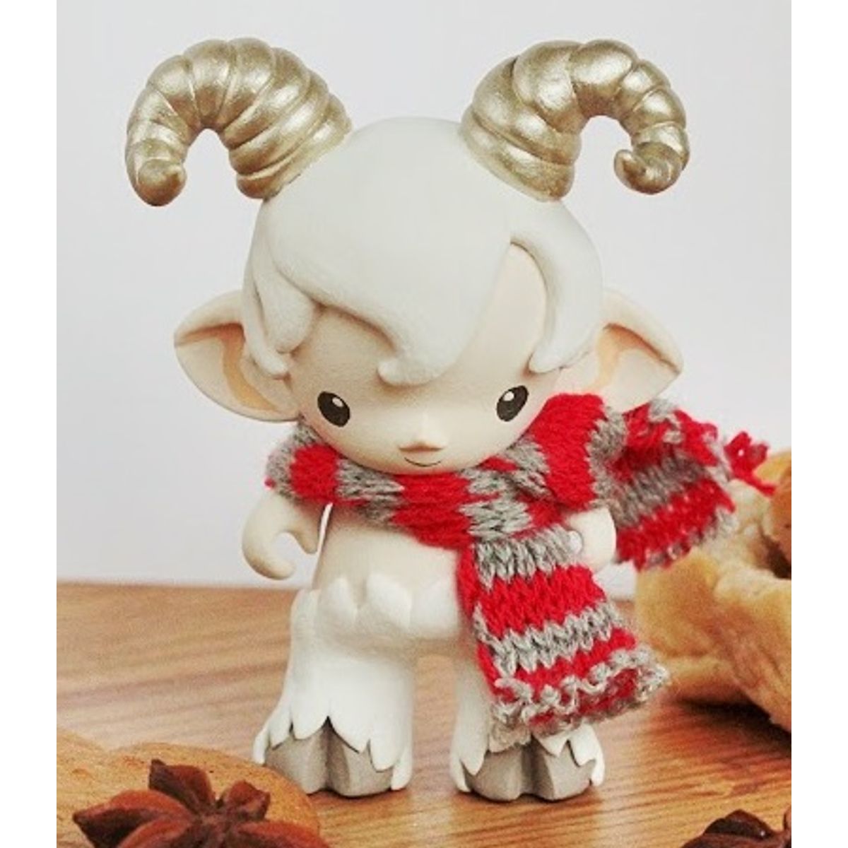 faun in white - golden crooked horns