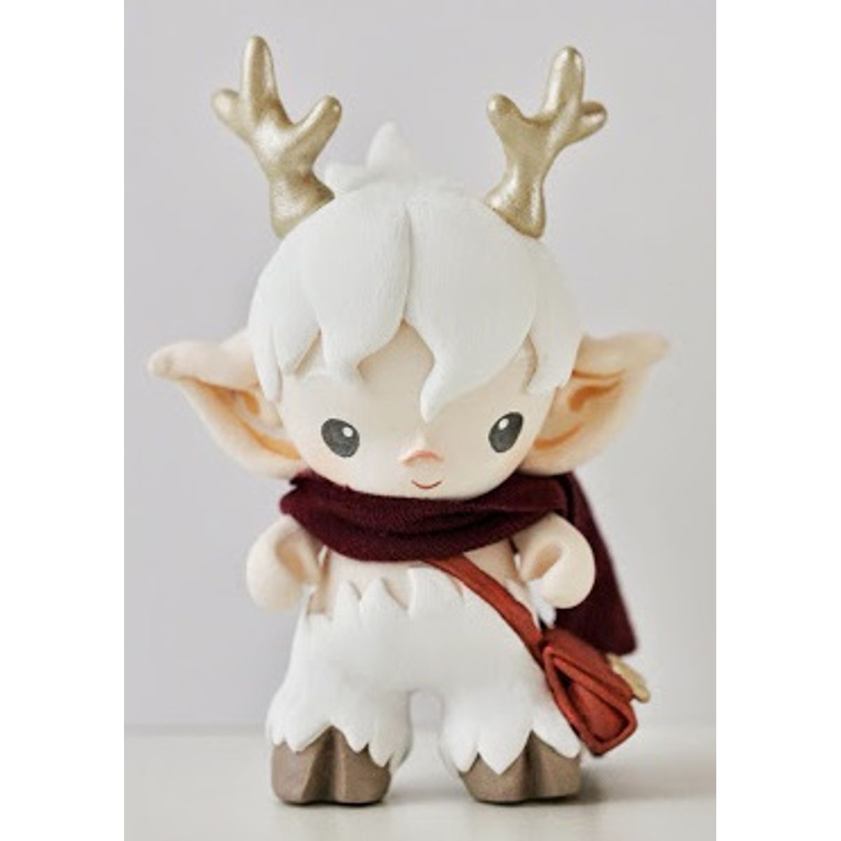 faun in white with messenger bag