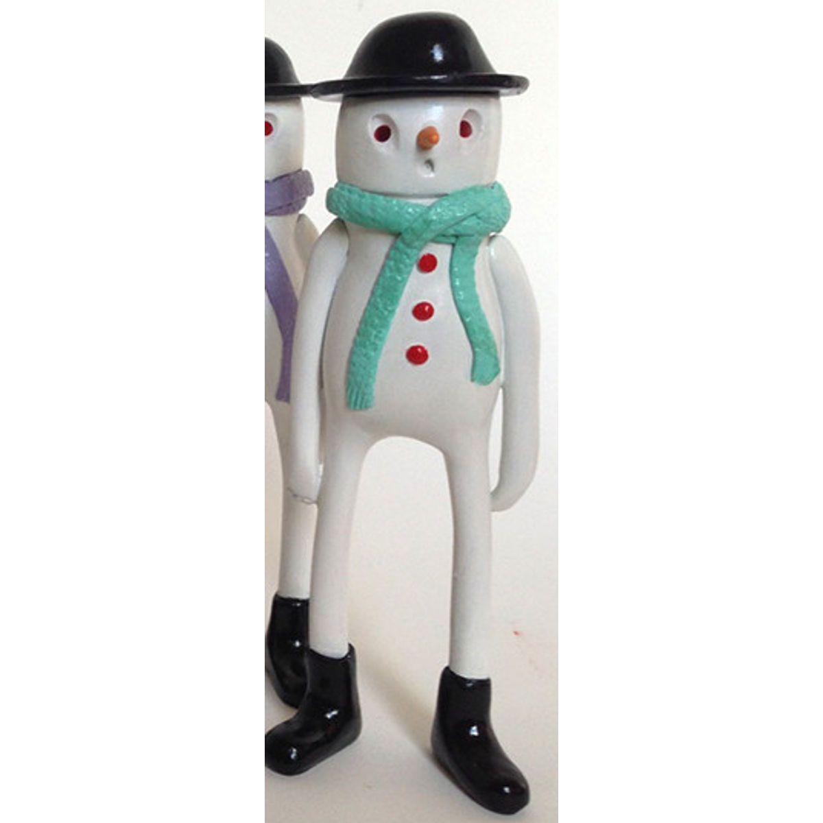 Snowman with green scarf